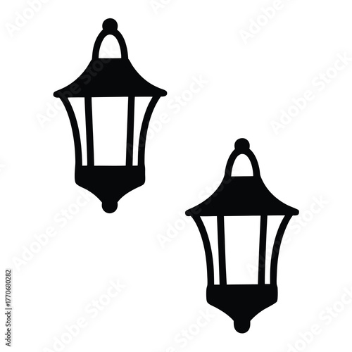 Two elegant outdoor lamps, providing light and style to any exterior space