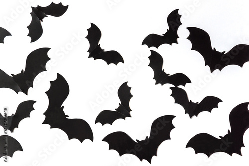 Black bats on a white background. Halloween holiday concept