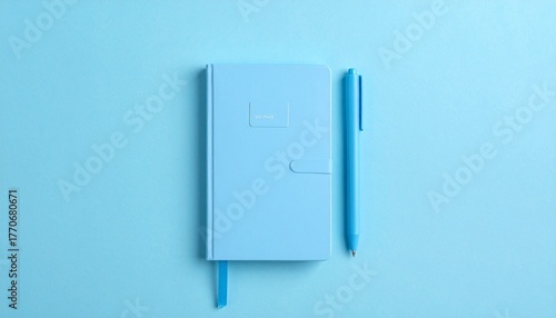 Minimalist Light Blue Notebook and Pen Set on Matching Monochrome Surface