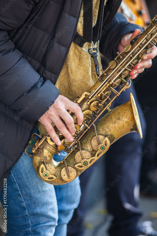 Naklejka premium A man is playing a saxophone