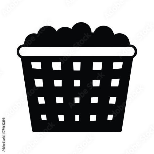 Black and White Laundry Basket overflowing with Clothes ready for cleaning