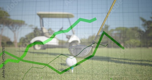 Golf club head sitting behind ball on teeing ground, with grid overlay and white golf cart