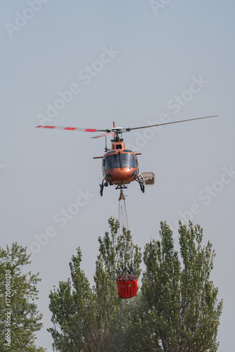 Helicopter in action during a firefighting mission