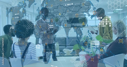 Presenters using laptop and tablet initiating world map animating over office for business meeting