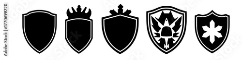 various heraldic shield designs in black and white, including crowned and embellished versions