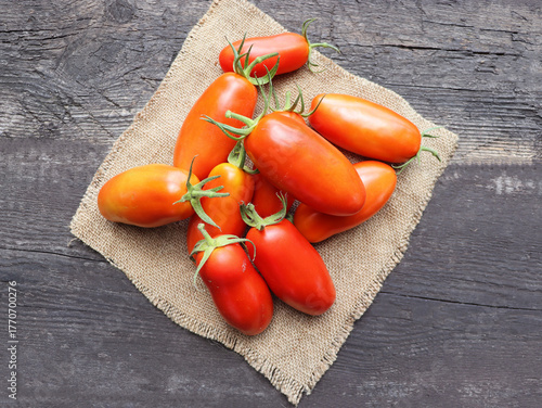 Freshly picked San Marzano tomatoes on a old wooden table