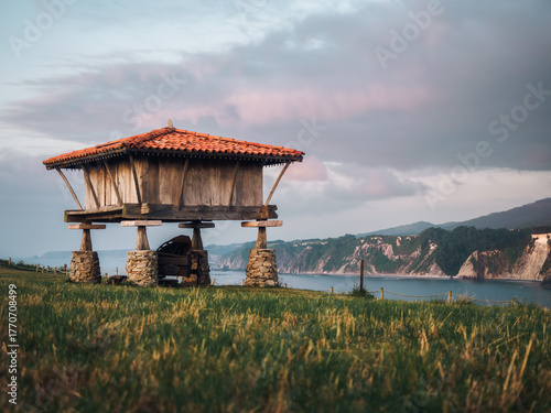 Galician granary at sunset facing the ocean
