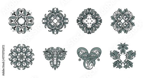 Eight intricate ornamental decorative elements featuring stylized floral and scroll designs in grey and white, perfect for elegant backgrounds.