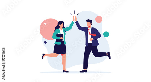 Two business professionals high-five, celebrating success and effective teamwork, illustrating a strong partnership and shared achievement.