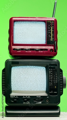 Retro TV, vintage television In a nostalgic setup, a retro TV displays grain on screen, scary halloween night device good for chroma key and green screen.