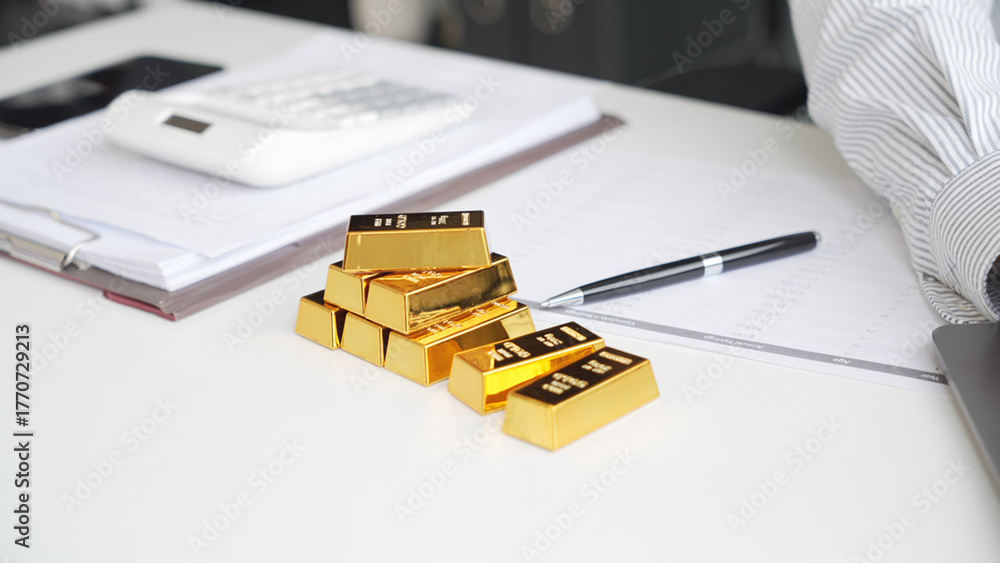 Fototapeta premium Silver Trading Businessman invest in trading silver, calculating price and monitoring online using smartphone