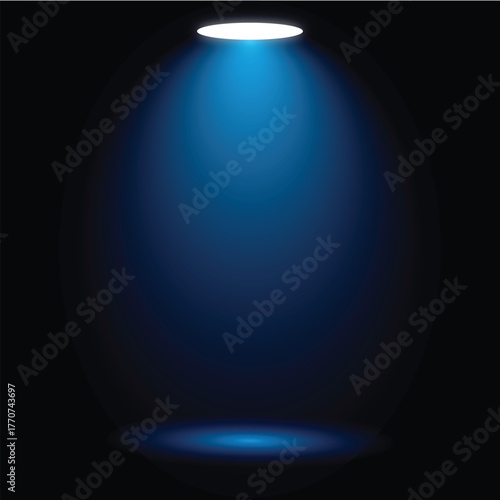 A single spotlight illuminates a dark space creating dramatic lighting effects