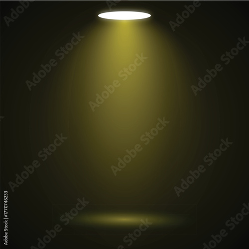 A single spotlight illuminates a darkened space with a golden glow