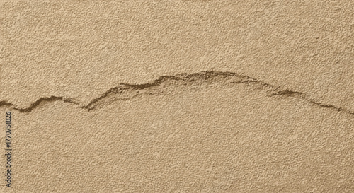Vector  close up of a textured beige surface with a dark crack running diagonally across the frame