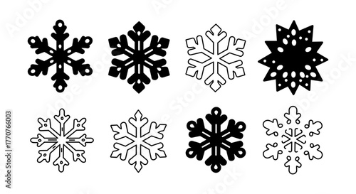 Set of eight black and white snowflake designs with geometric patterns