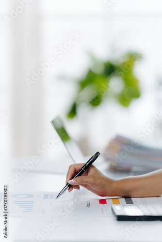Penning Precision: A close-up shot of a hand meticulously writing with a pen on paper, signifying thoughtful analysis and deliberate documentation.