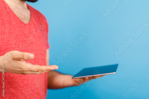 Person holding tablet, offe...