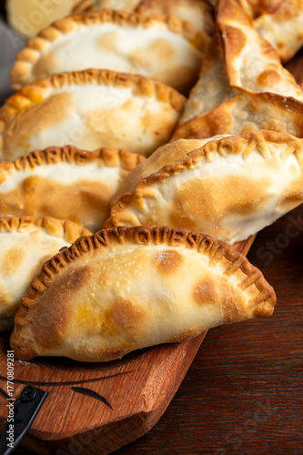 Baked Creole empanadas made with homemade dough filled with meat, ham and cheese, vegetables, Roquefort cheese, bacon, egg, olives, vegan and vegetarian. 