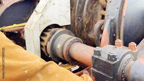 Bosun operates windlass and lifts anchor — real footage of full anchor heaving process on cargo ship. The anchor chain moves through the guides and drops into the chain locker.