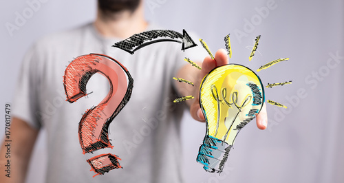 Hand holding a lightbulb, t...