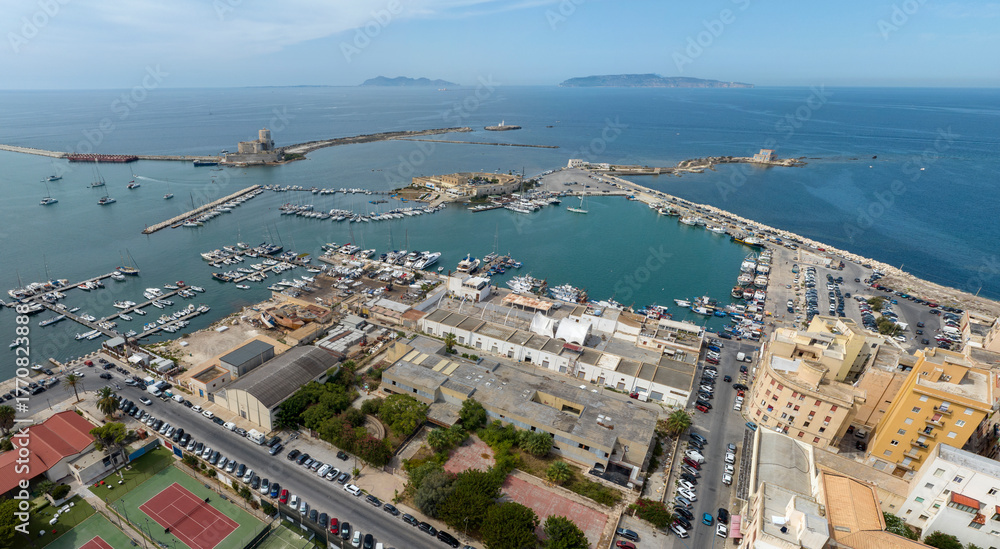 Obraz premium Aerial view of houses and buildings in the historic center of Trapani, Sicily, Italy. It is a beautiful city overlooking the Mediterranean Sea. The Aegadian Islands are in the background.