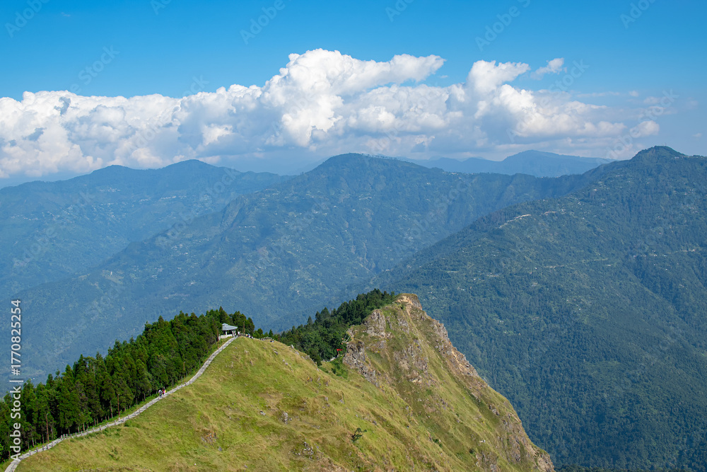 Fototapeta premium Tarey Bhir point,favourite tourist spot, Sikkim,India. A long path on the hills, a breathtaking viewpoint at the end of the edge, tourists get spectacular view of Himalayan mountains in front of them.