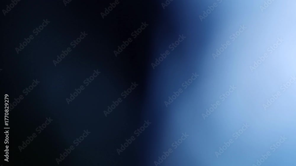 Una toma de cerca de un fondo abstracto de color azul con negro un degradado ligero desenfocado en movimiento