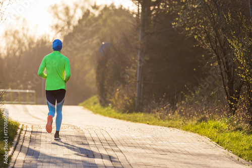 Wallpaper Mural man running in the park Torontodigital.ca