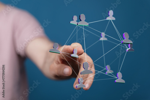 Hand holding a network of p...