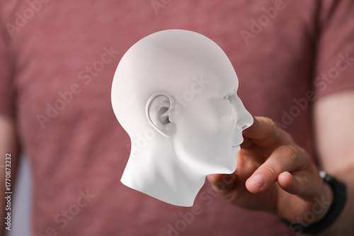 Person interacts with 3D he...