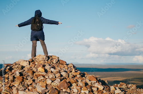 Hiker Standing on Rocky Summit in Lapland, Finland