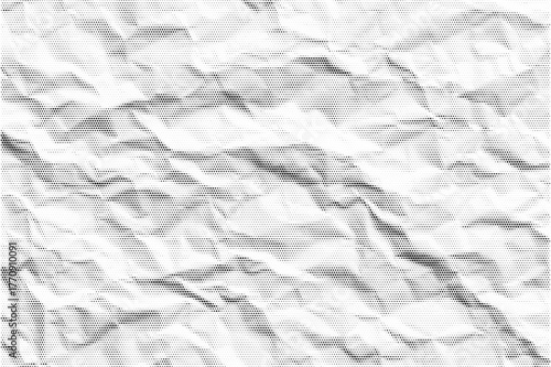 Old halftone overlay scrapbook texture with detailed folds and realistic grain. Black dotted duotone pattern for vintage collage, or retro grunge designs.