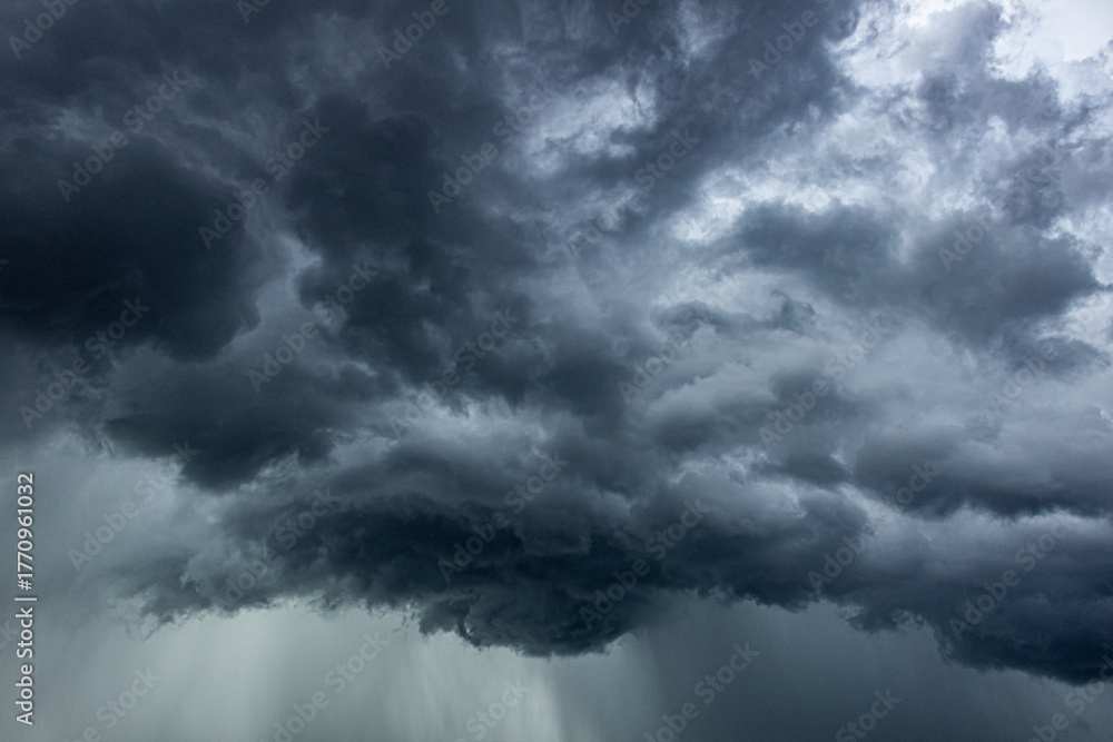 Fototapeta premium Dramatic dark stormy sky with rain clouds, natural background