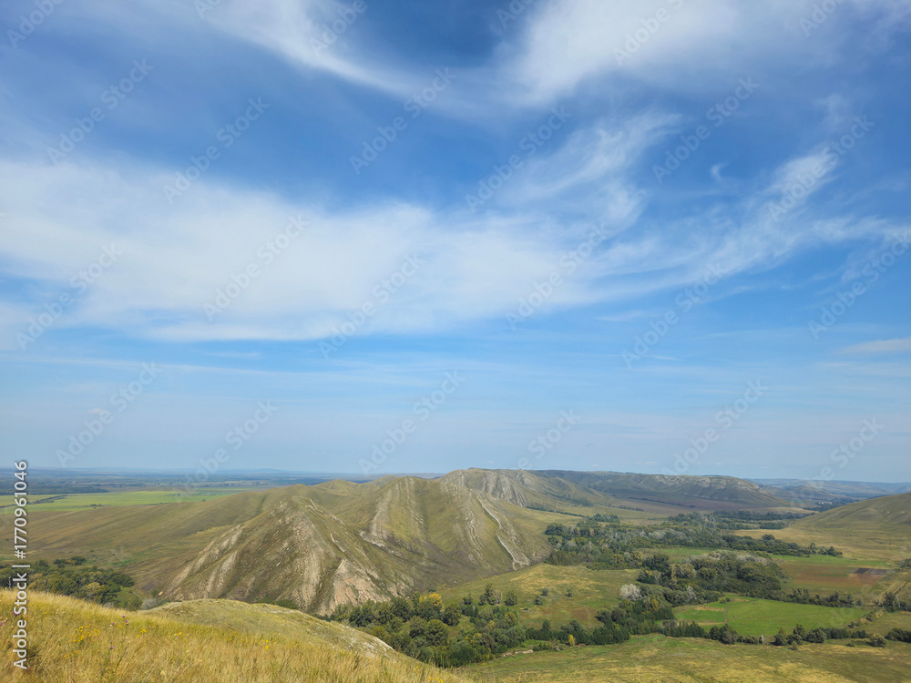 Fototapeta premium nature of Russia. Vast valley landscape viewed from elevated vantage point. freedom, boundless horizons, and nature's majestic untouched beauty from above.