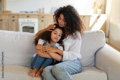 Принти на полотні Loving mother comforting upset preteen daughter, sitting together on sofa, mom soothing kid, free space