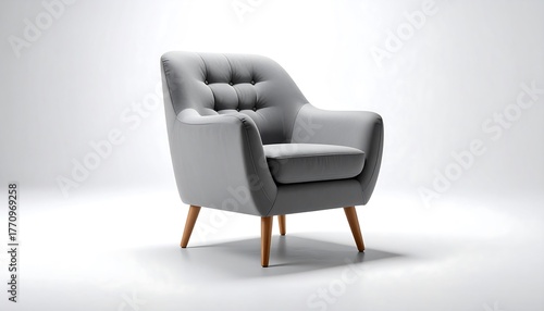 Elegant grey tufted armchair with wooden legs on a clean white background.