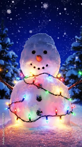 Charming snowman decorated with a festive garland of lights in a magical snowy night forest scene. The vertical composition is perfect for winter holiday social media stories and phone wallpapers.