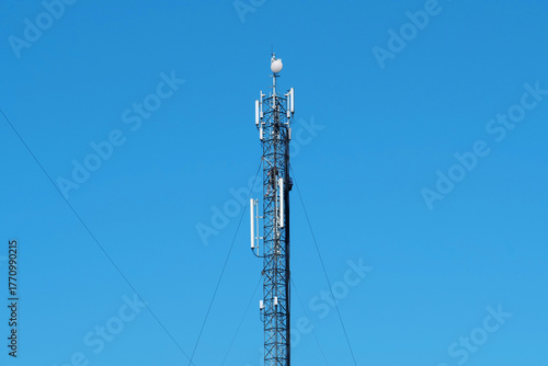 Maintenance staff at the work. High-altitude work. Worker repair cell tower