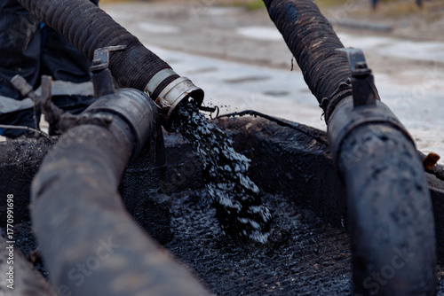ndustrial crude oil producer demonstrates the flow of liquid. Oil and gas production concept