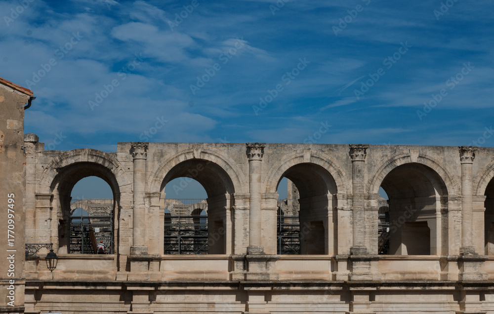 Obraz premium Arches of Coliseum in Arles France on A sunny Day 