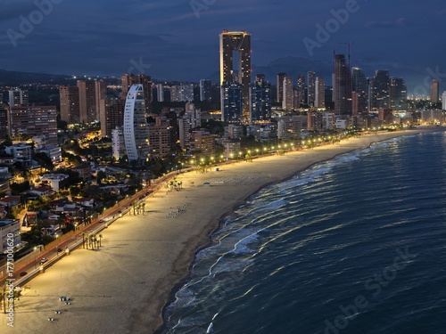 Tableau sur toile luminous tower and bustling boulevard, city skyline and glowing beach with livel