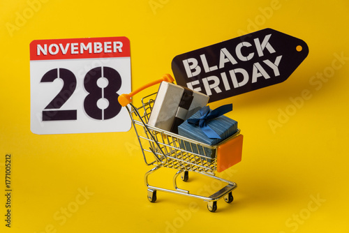 Shopping cart carrying gifts for black friday, november 28th
