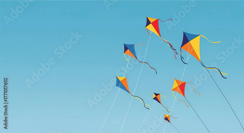 Group of colorful, stylized kites of various sizes flying in a clear blue sky, with white lines trailing downwards, ample copy space below.