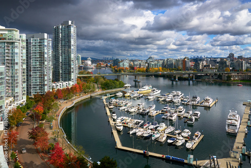 Marinaside Autumn Vancouver Colour and Black Clouds. A Yaletown street along the edge of False Creek in autumn. Vancouver. British Columbia, Canada.
