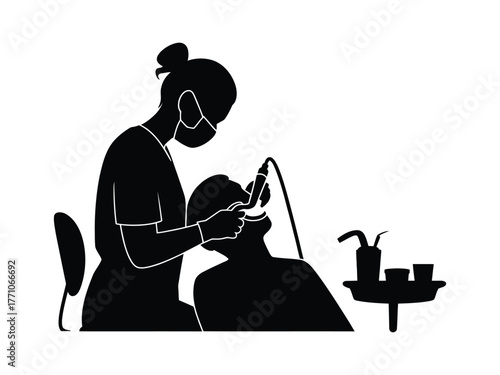 Dental hygienist performing procedure on patient dental chair dental equipment