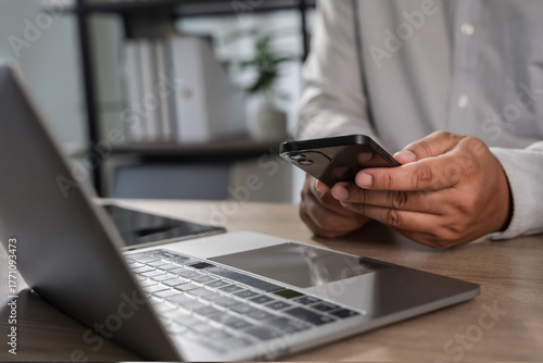 man checking new email notification on phone in workplace Communication networking or social media. Agenda, app and schedule with man checking calendar