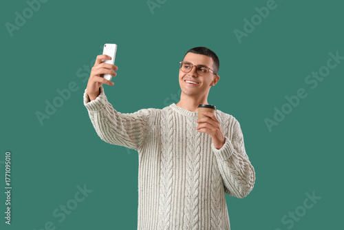 Young man in knitted sweate...