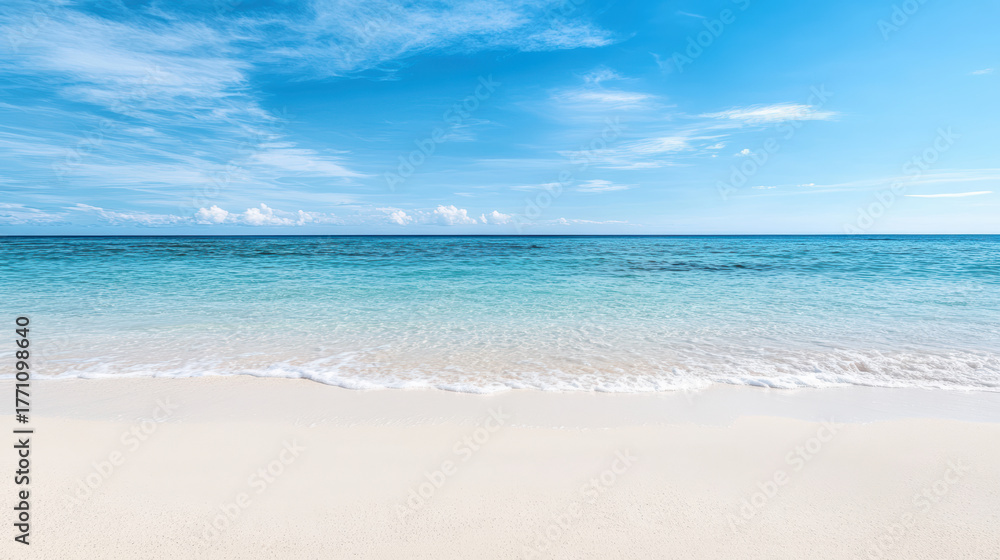 Fototapeta premium Serene turquoise sea meets clear blue sky, creating tranquil beach scene