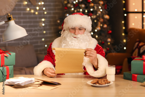 Santa Claus reading letter ...