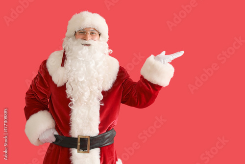 Santa Claus showing somethi...